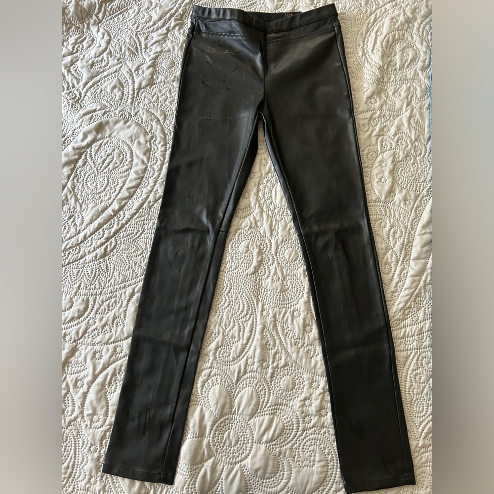 Blank NYC black vegan leather-look leggings. 12. Hidden elastic waistband. Nice!